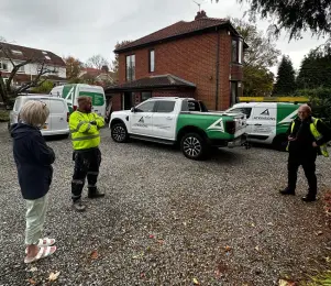 The ATKINSONS team talking through a job with a customer