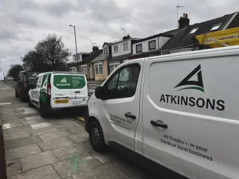 ATKINSONS vans parked on a terraced street in the North East