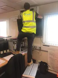 Air conditioning repair specialist at work