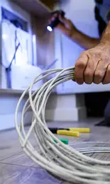 electrical technician carrying out maintenance at HMS