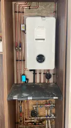 Close-up of copper pipework and valves on a domestic boiler installation