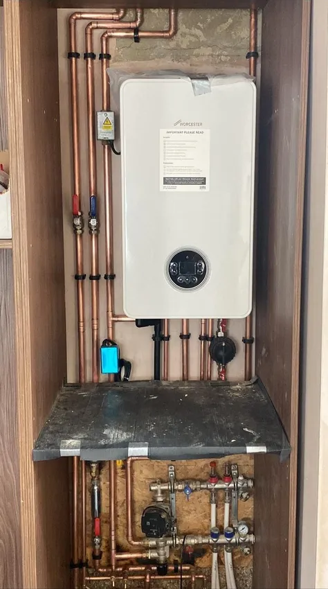 Close-up of copper pipework and valves on a domestic boiler installation