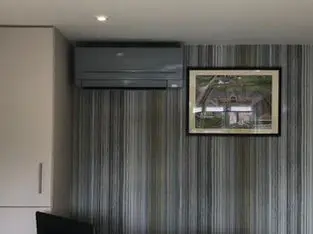 Air conditioning unit installed in a bedroom